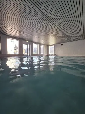 an empty swimming pool with a large ceiling at 