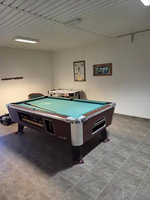 a room with a pool table in a room at 
