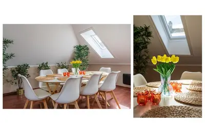 a dining room with a table and chairs and yellow flowers at Big, Bright & Beautiful - with 6 Large Bedrooms in Bergen