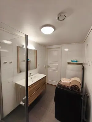 a bathroom with a sink and a shower at Modern 3-Bedroom Apartment in Central Voss - Prime Location in Vossevangen