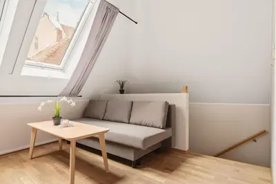 a living room with a couch and a table at Leiligheter i sentralt Bergenshus in Bergen