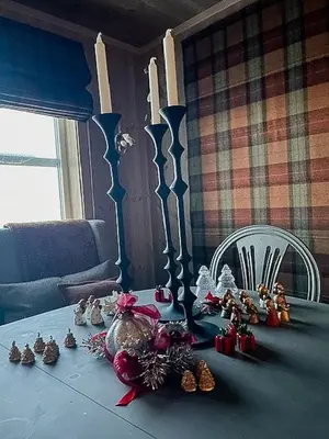 a table with christmas decorations on top of it at Modern Cabin With Views Of Langsua National Park in Etnedal