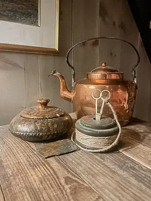 an old tea pot and a tea kettle on a table at Modern Cabin With Views Of Langsua National Park in Etnedal
