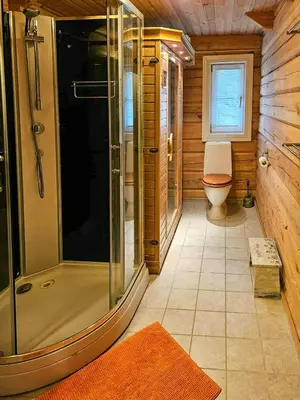 a bathroom with a shower and a toilet at Family Cabin With Views Towards Solentoppene in Nymoen