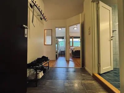 a hallway with a door leading to a bedroom at Central Apartment in Geilo in Geilo