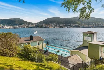 a view of a body of water with houses at Central, lovely apartment with a unique view in Bergen