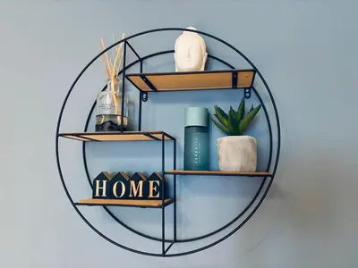 a circular shelf with a home sign on a wall at Central Apt - Steps to Fish Market and Bryggen in Bergen