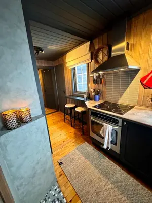 a kitchen with a stove and a counter top at Charming cabin with lovely views at Geilo in Geilo