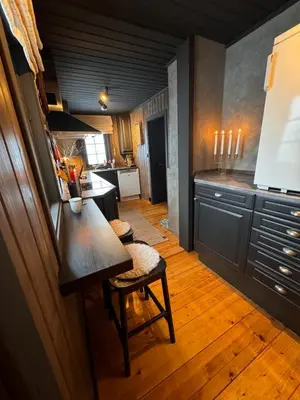 a kitchen with a table and chairs in a room at Charming cabin with lovely views at Geilo in Geilo