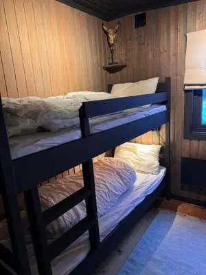 a bunk bed in a room with a bunk bed at Charming cabin with lovely views at Geilo in Geilo