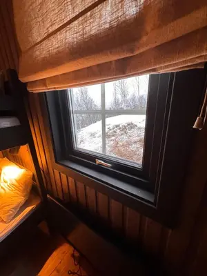 a window in a room with a winter view at Charming cabin with lovely views at Geilo in Geilo