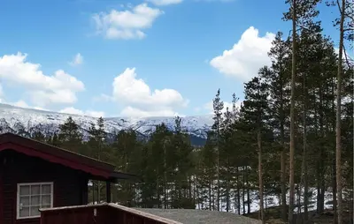 a house with a view of a snow covered mountain at Amazing Home In Lesjaverk With Wi-Fi in Bjorli