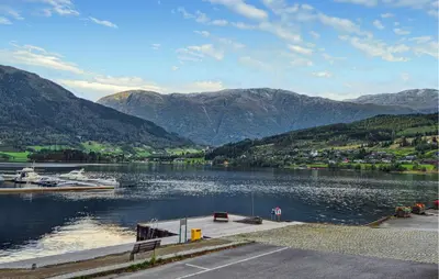 a view of a lake with mountains in the background at Awesome Apartment In Ulvik With House Sea View in Ulvik