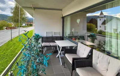 a balcony with a table and chairs and a view at Awesome Apartment In Ulvik With House Sea View in Ulvik