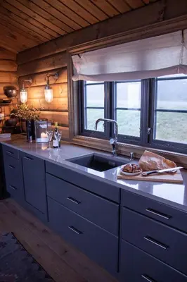 a kitchen counter with a sink and a window at Fjellhytte Med 4 Soverom, Sauna, Peis Og Terrasse in Beitostøl