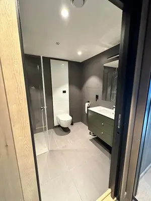a bathroom with a toilet and a sink at New apartment in Hemsedal Fjellandsbyen in Hemsedal