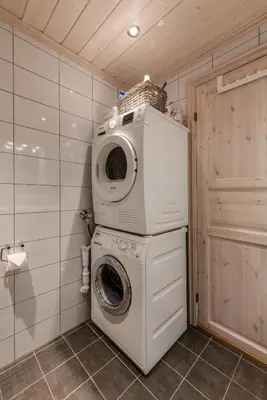a washing machine with a basket on top of it at Geilotunet Apartment - close to everything, free parking in garage, EV in Geilo