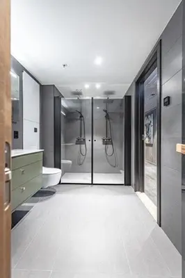 a bathroom with a walk in shower and a toilet at Ski out ski in Luxus Hemsedal in Hemsedal