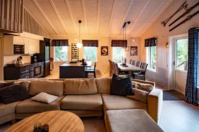 a living room with a couch and a table at Trysilfjellet Nord 267 in Trysil