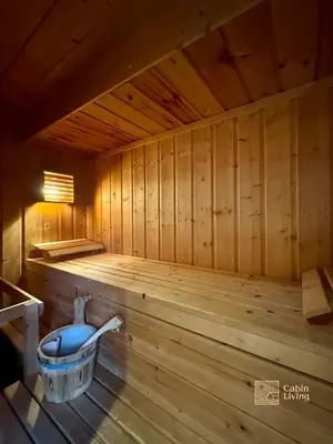 a inside of a wooden sauna with a bucket at Ski in-out cabin Trysil sauna, fireplace and views in Trysil