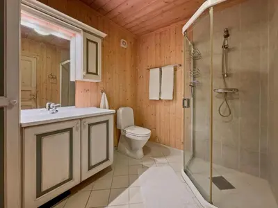 a bathroom with a shower and a sink and a toilet at Mountain cabin in Aurdal Fireplace Sauna 1000 meters above sea level in Aurdal