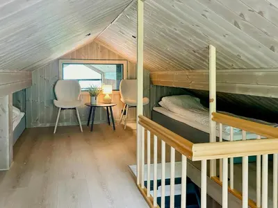 a bedroom with a bunk bed in a tiny house at Renovated Cabin With Views Over Breimsvatnet in Klakegg