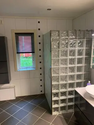 a bathroom with a shower and a sink at Mountain Retreat in Brattvg - Unwind in Nature in Brattvåg
