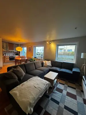a living room with a couch and a table at Gimleveien 36G in Bergen