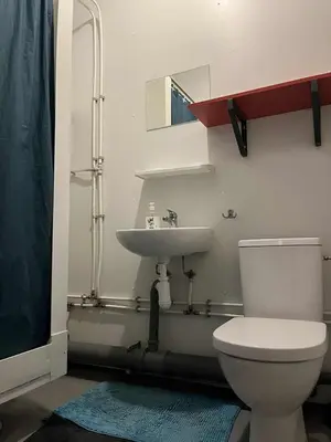 a bathroom with a toilet and a sink at Compact living with all you need, close to the centre! in Røros