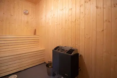 an empty sauna with a television in the corner at Bakkebyvegen 7A in Trysil
