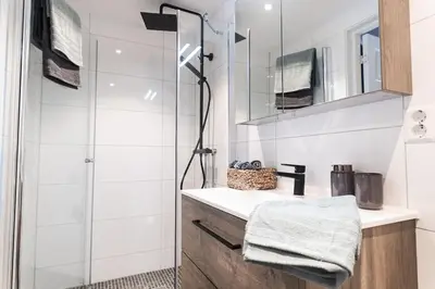 a bathroom with a shower and a sink at Charming apartment with lodgefeeling in Hemsedal