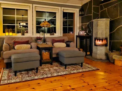 a living room with a couch and a fireplace at Cozy Family Cabin At Hamlagrø in Vossevangen