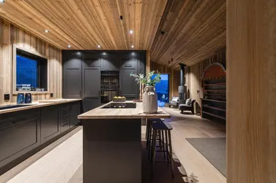 a kitchen with a island with a vase on it at Nyørk Chalet, Hemsedal in Hemsedal