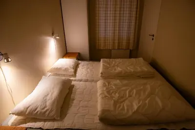 a bedroom with two beds with white sheets and pillows at Høyfjellsgrend 961, 36b in Trysil