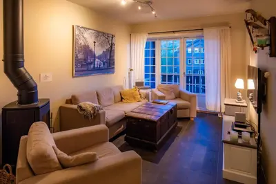 a living room with a couch and a table at Høyfjellsgrend 961, 36b in Trysil