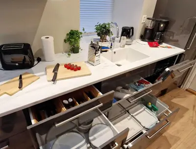a kitchen with a counter top with a sink and a counter at King Bed Renovated and Cozy Near Bryggen in Bergen