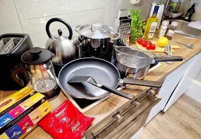 a kitchen counter with a frying pan on a stove at Torgalmenningen Town Square, Yet quiet, Elevator in building in Bergen