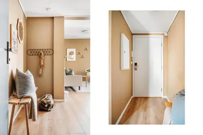 a living room and a hallway with a door at Barfot Apartment - Bergen City center in Bergen