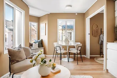 a living room with a table and chairs at Barfot Apartment - Bergen City center in Bergen