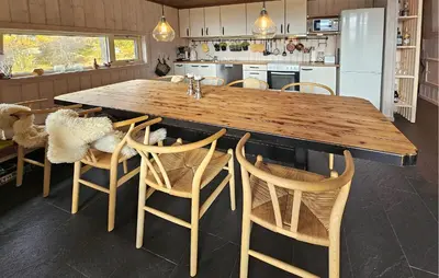 a kitchen with a large wooden table and chairs at Nice Home In Tinn Austbygd With Sauna in Luråsgrendi