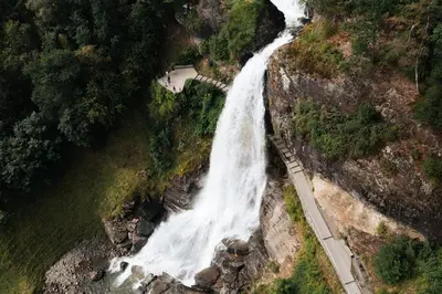 an aerial view of a waterfall on the side of a mountain at Toppleilighet i sentrum av øystese in Kvam