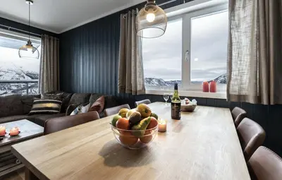 a dining room with a table with a bowl of fruit at Ski in-Ski out and True Mountain Charm in Hemsedal
