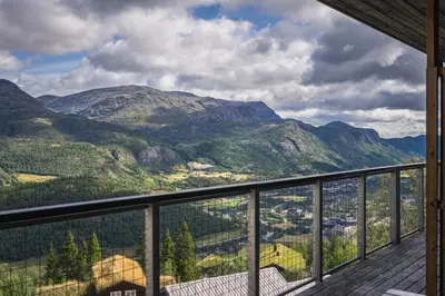 a view of the mountains from the balcony of a house at Ski in-Ski out and Perfect for Families in Hemsedal