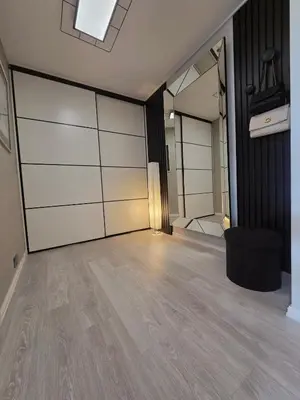 a living room with a large room with wood floors at Apartment, everything close in Hamar