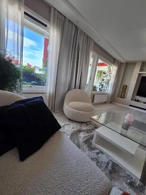 a living room with a couch and a glass table at Apartment, everything close in Hamar