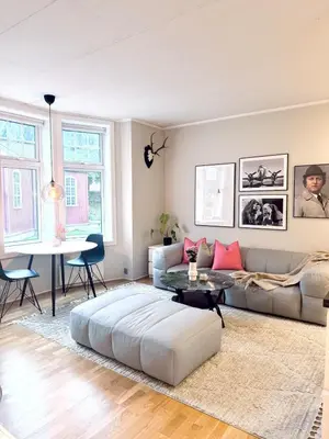 a living room with a couch and a table at Nice apartment super central at Solsiden in Trondheim