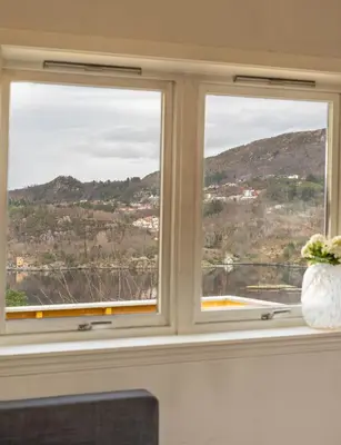 a window with a view of a mountain at Small house close to nature and city in Bergen