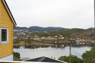 a view of a body of water next to a house at Small house close to nature and city in Bergen