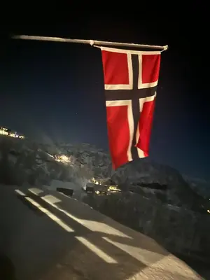 a flag on top of a mountain at night at Nice cottage in quiet surroundings, surrounded by beautiful nature, near Gullingen in Gullingen