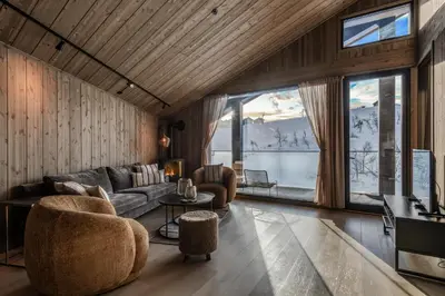 a living room with a couch and a table at Kikut Alpin Lodge 1302 in Geilo